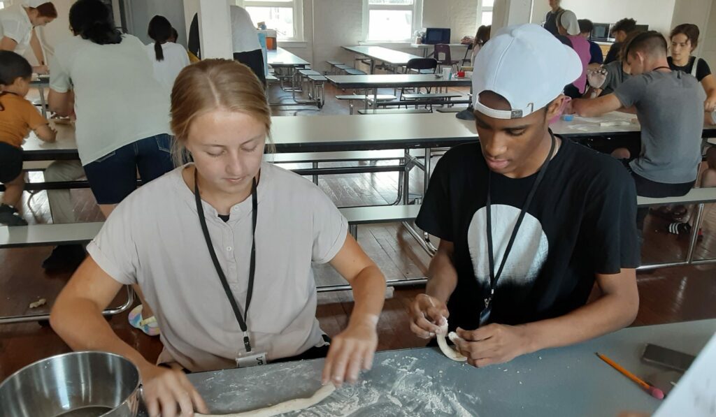 people making pizza